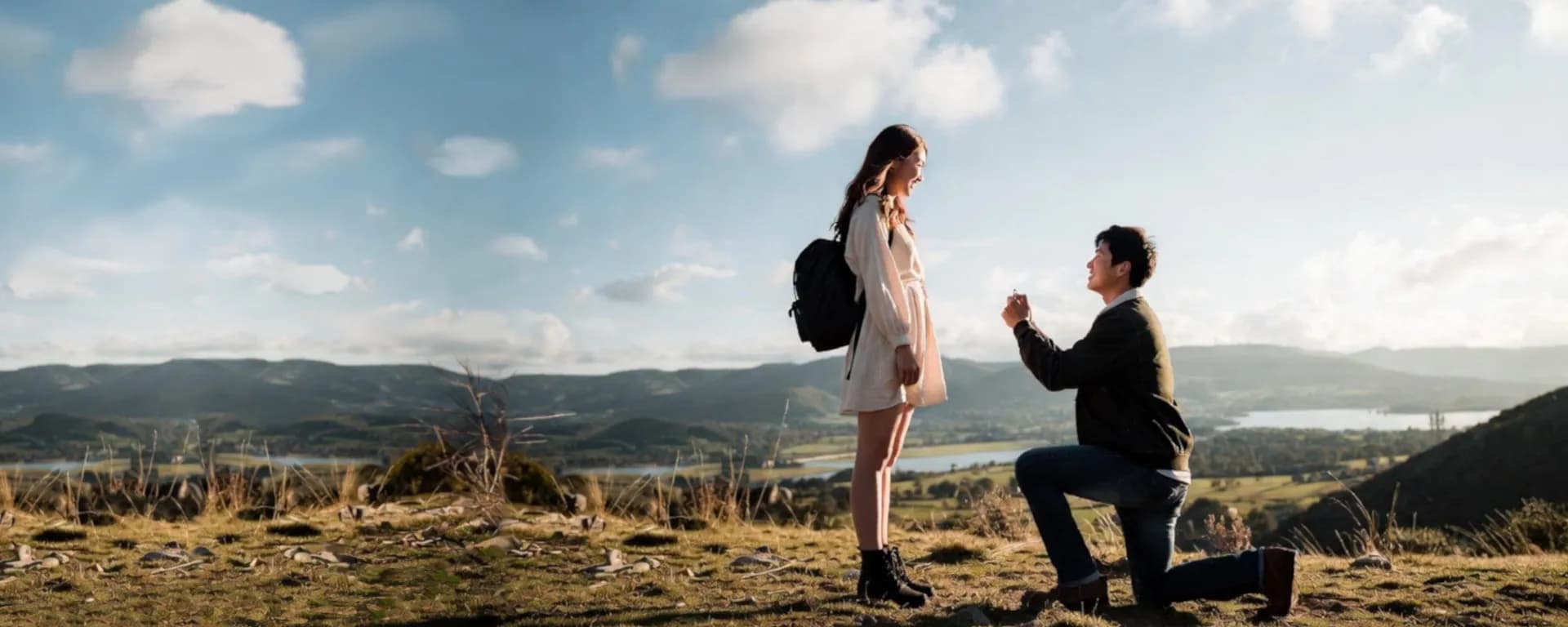 Romantic proposal on a hilltop